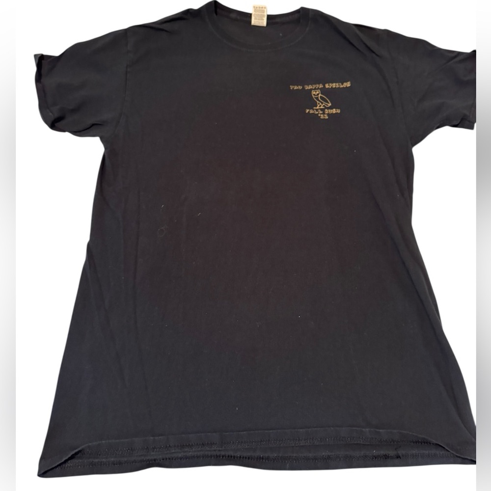 Black short sleeve t-shirt with gold owl design. Size M. GUC